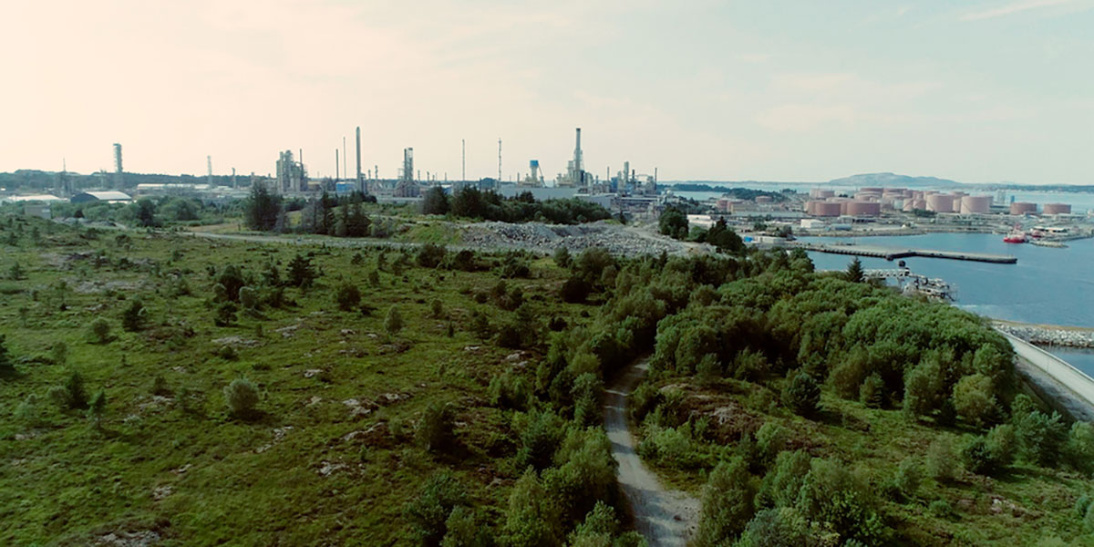 Factories surrounded by nature, image from 'Carbon and Captivity' film, 2020, photography Oliver Ressler, Gucci Carbon Offsetting, Lampoon