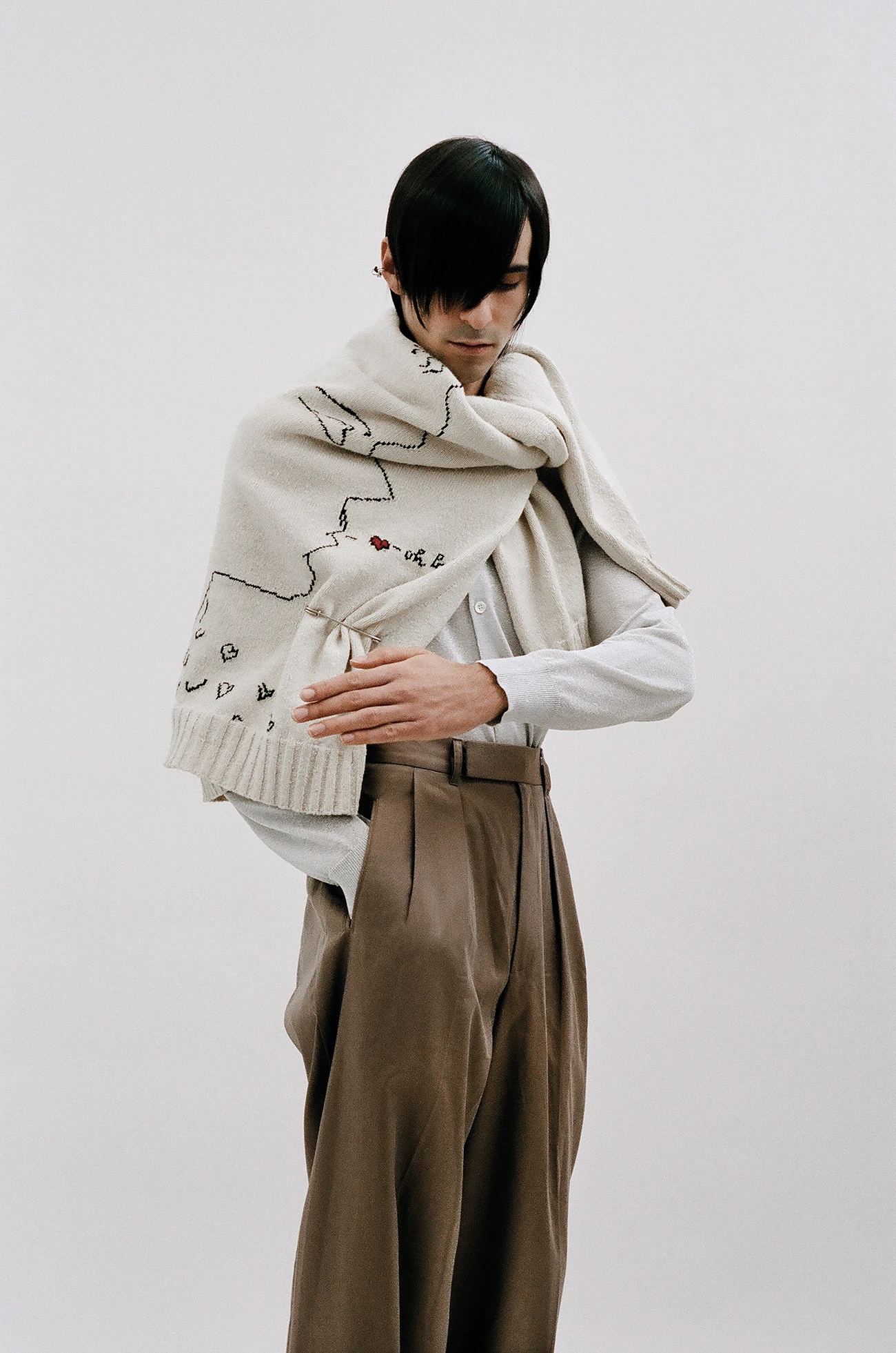 In-dividuo, piercing D’heygere, knitwear Calvin Klein archive shirt Grifoni, pants Ermenegildo Zegna