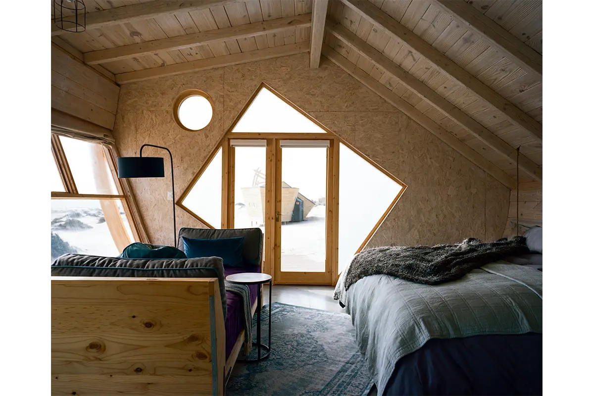 Shipwreck Lodge's angular wooden cabins are fashioned with recycled timber and chipboard, photography Michael Turek