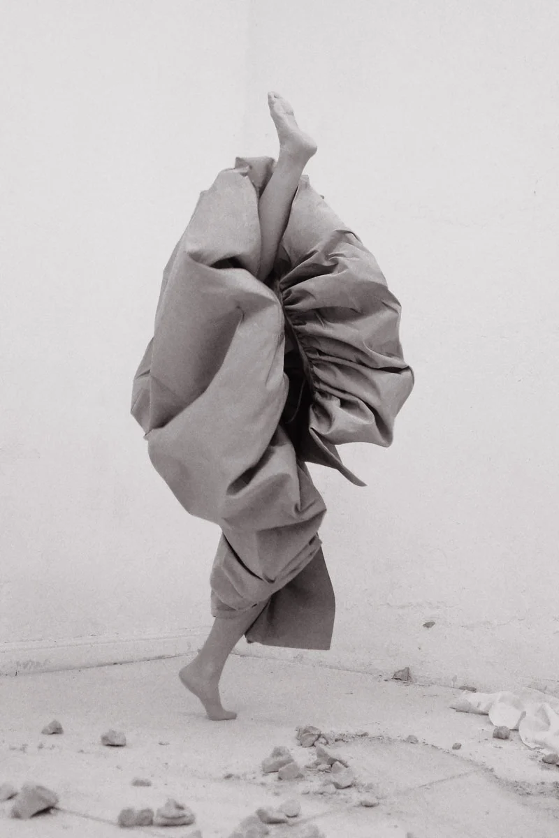 Full look Alexander Mcquenn. Photography and performance Isabelle Wenzel, fashion editing Arianna Bonifazi