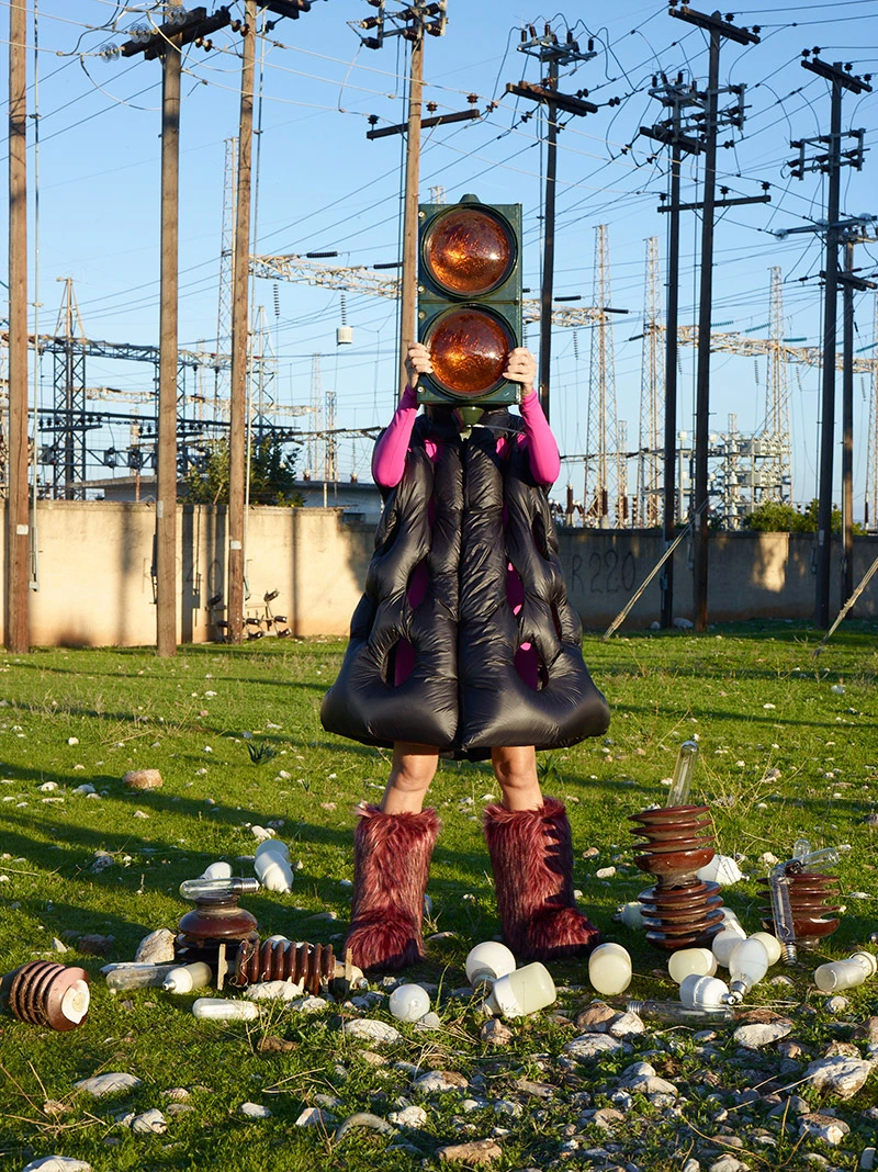 Coat, top and boots Moncler + Dingyun Zhang Installation and photography Petros Efstathiadis