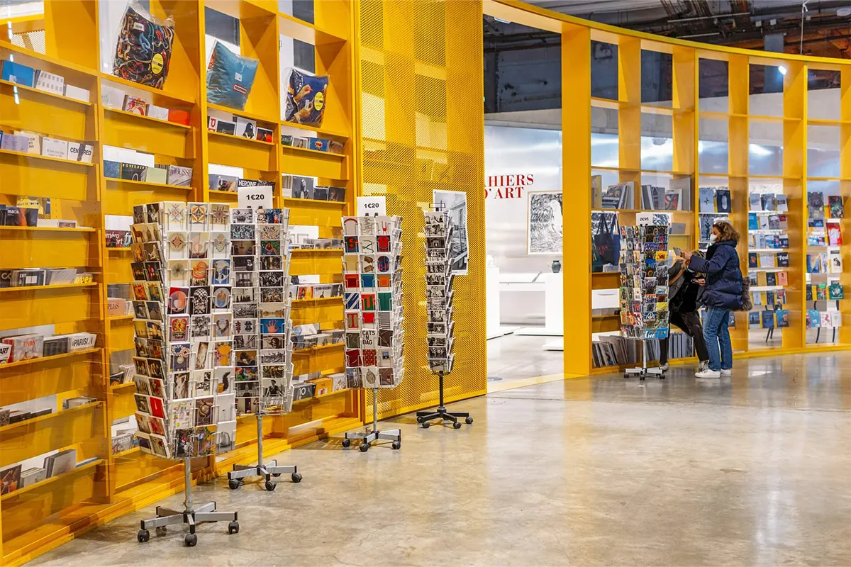 The yellow shelves of Palays de Tokyo bookstore in Paris, postcards