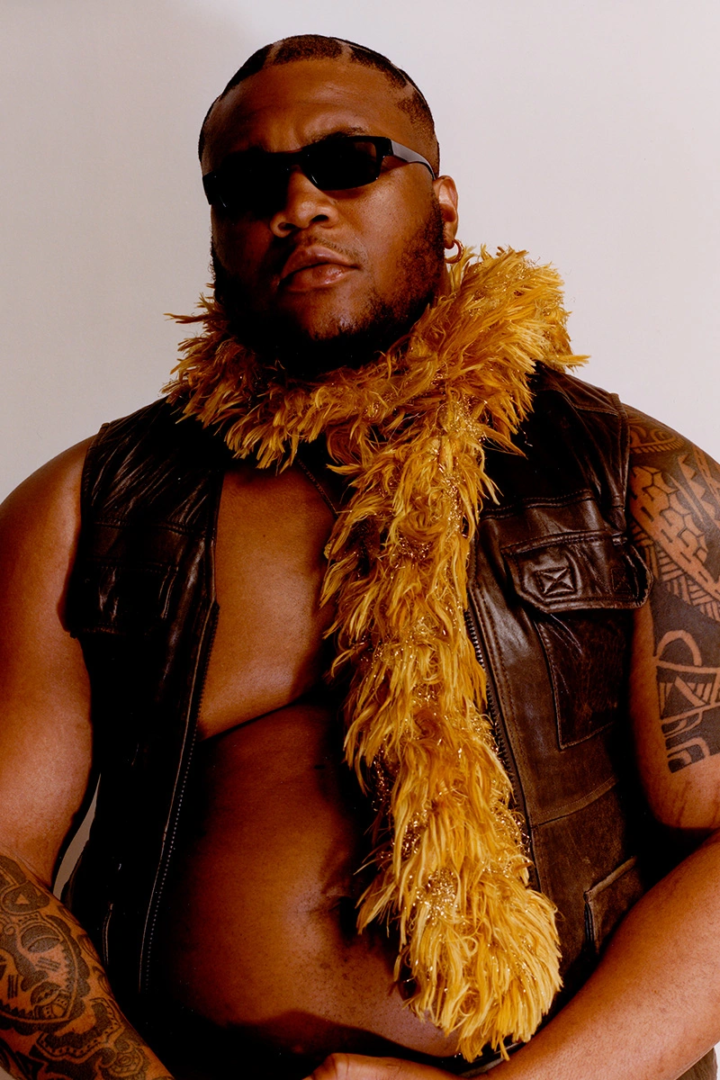 Marquis wears vintage vest, sunglasses and scarf from stylist’s archive