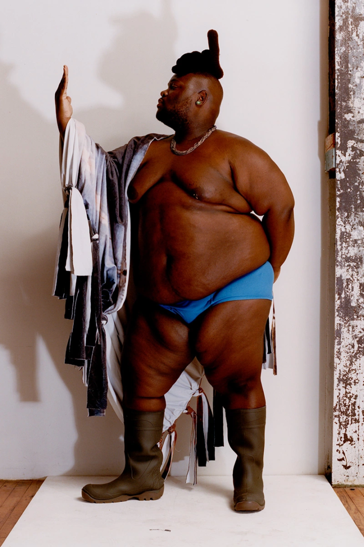 Tevin wears scarf by Dylan Mekhi. Underwear by Dickies. Boots by UGG. Jewelry from stylist's archive