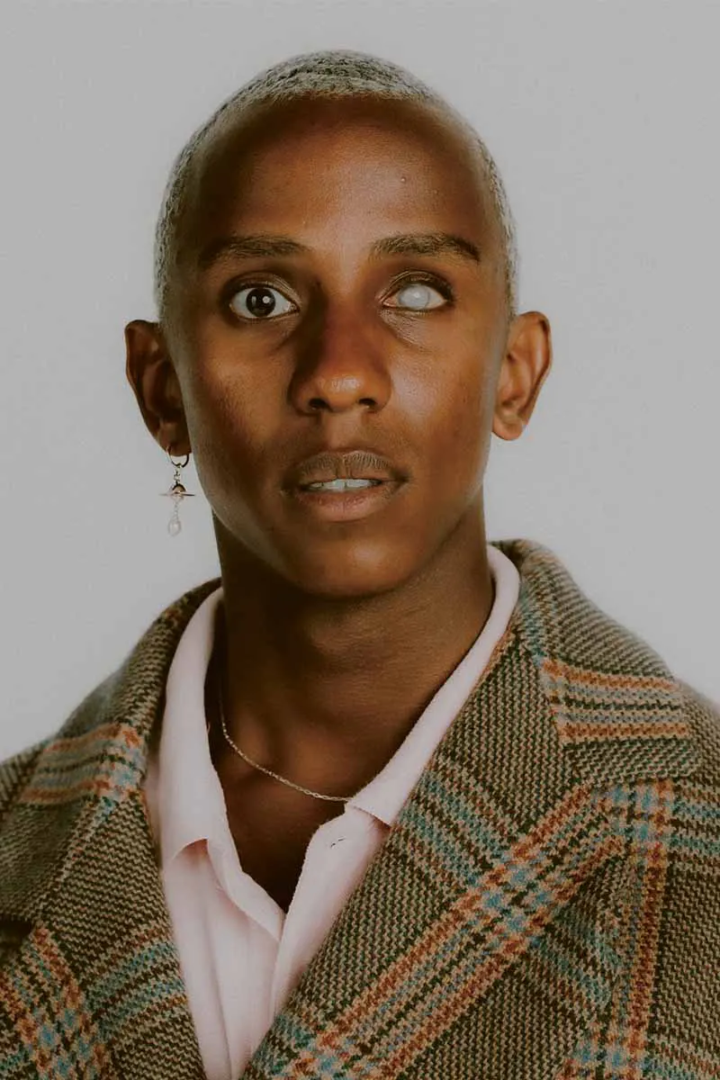 Coat and earring Vivienne Westwood, polo Polo Ralph Lauren