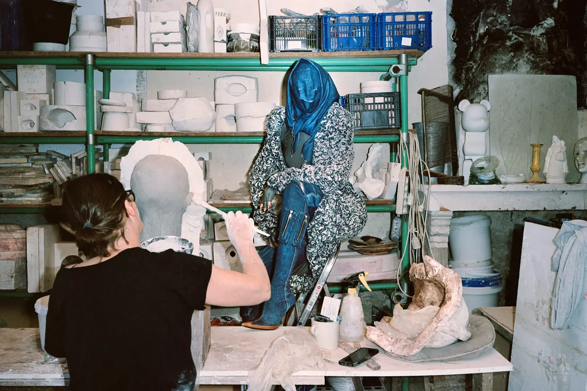 Dress and pantashoes Diesel by Glenn Martens, onesie Dstm, scarf and hood stylists own. Photography Maxime Ballesteros, styling Damèse Savidan