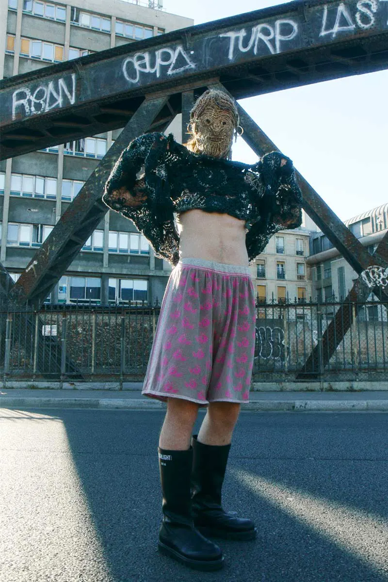 Lampoon, sweater and shorts Maria Streang, boots Highlight Studio, mask Agglomerati