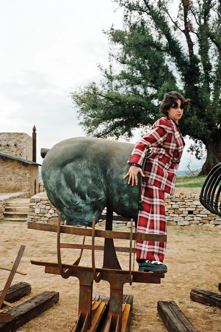 Franziska wears jacket and pants ARTHUR AVELLANO, shirt underneath BARBOUR, shoes CHANEL, sculpture by Gustavo Aceves. Photography Luke Wassmann