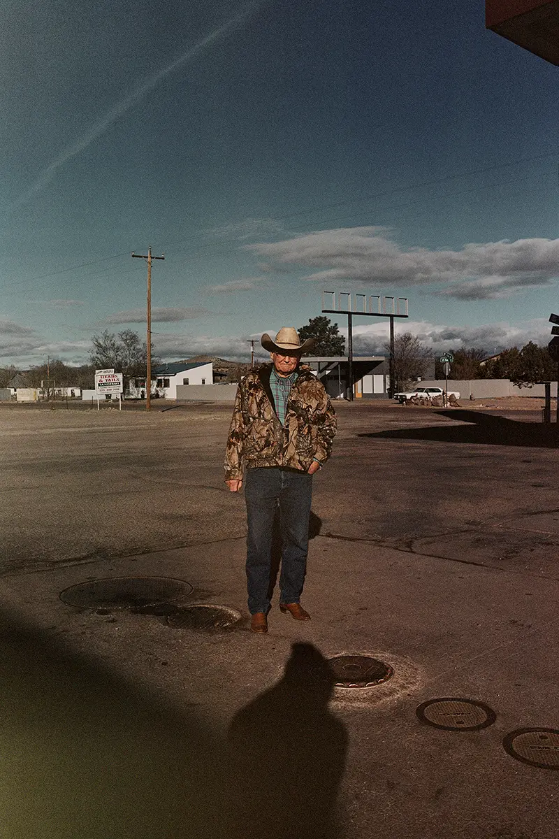 Lampoon, John Spyrou in New Mexico photographing an American man