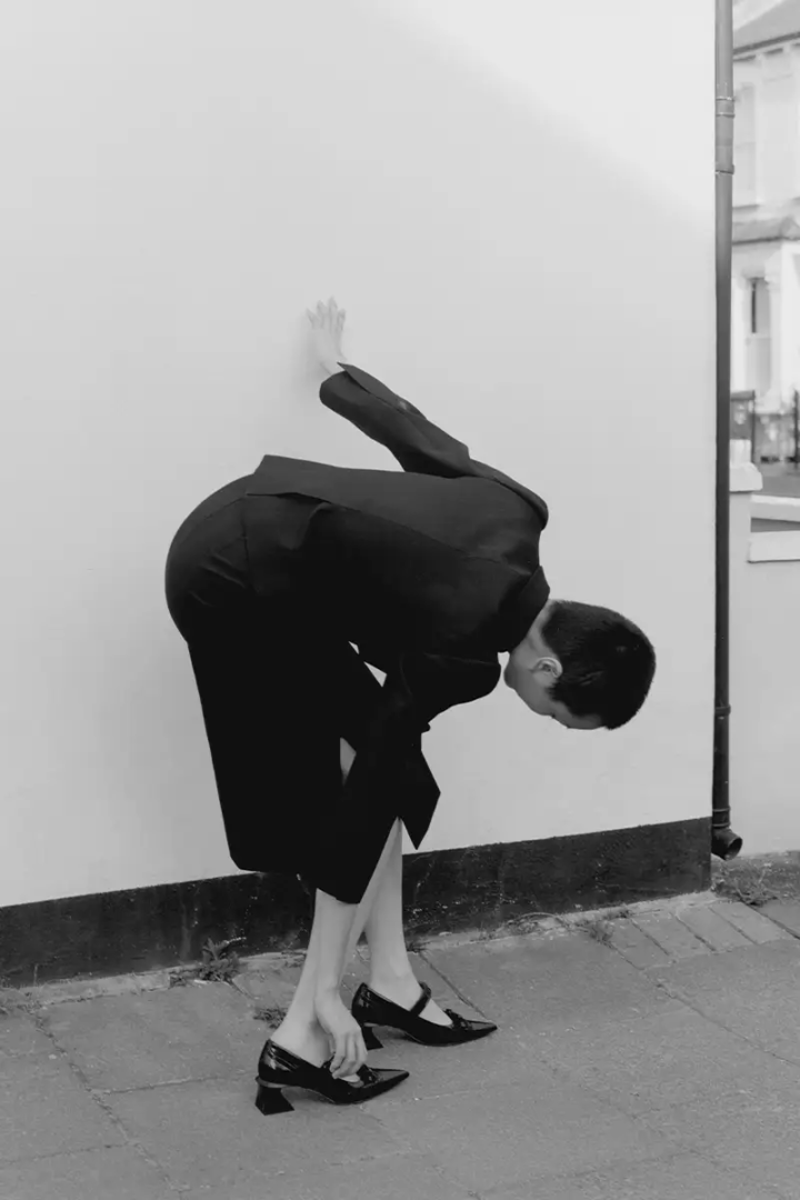 suit and shoes SHUSHUTONG, earrings SIMONE ROCHA