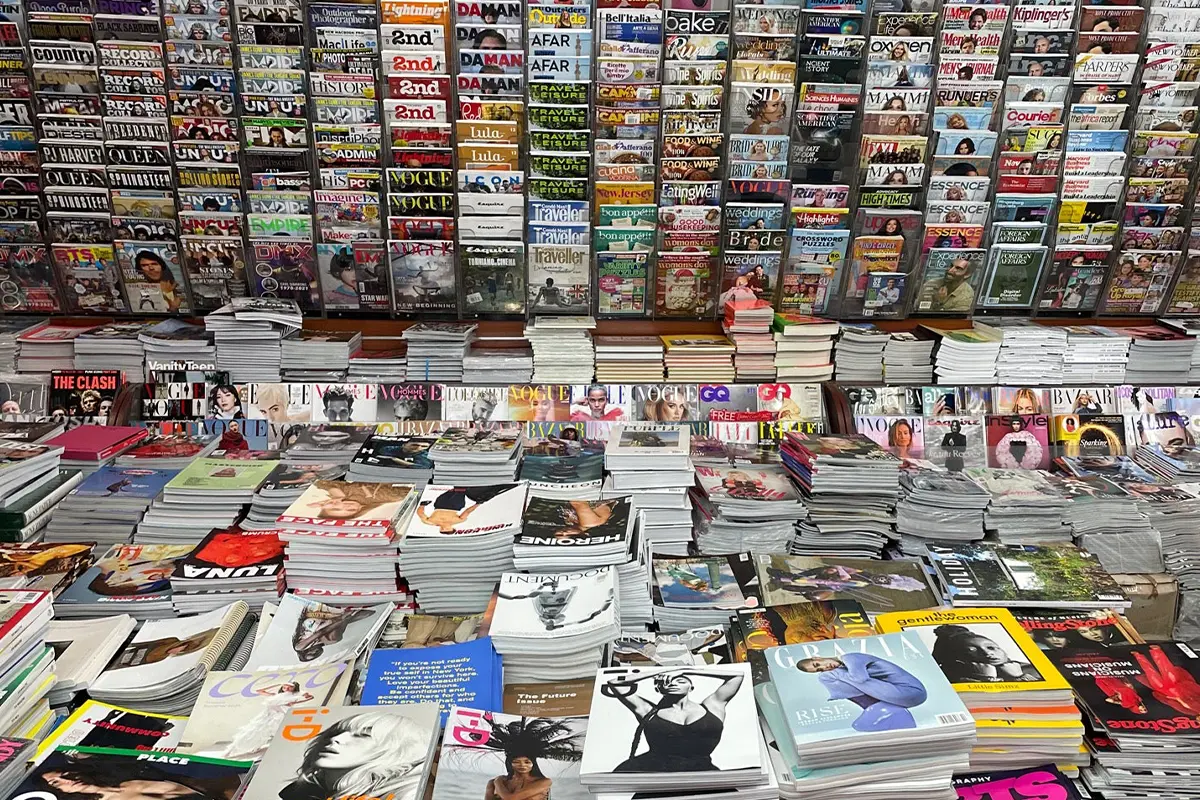 Iconic Magazines NYC, Mulberry. Mags stacked along walls