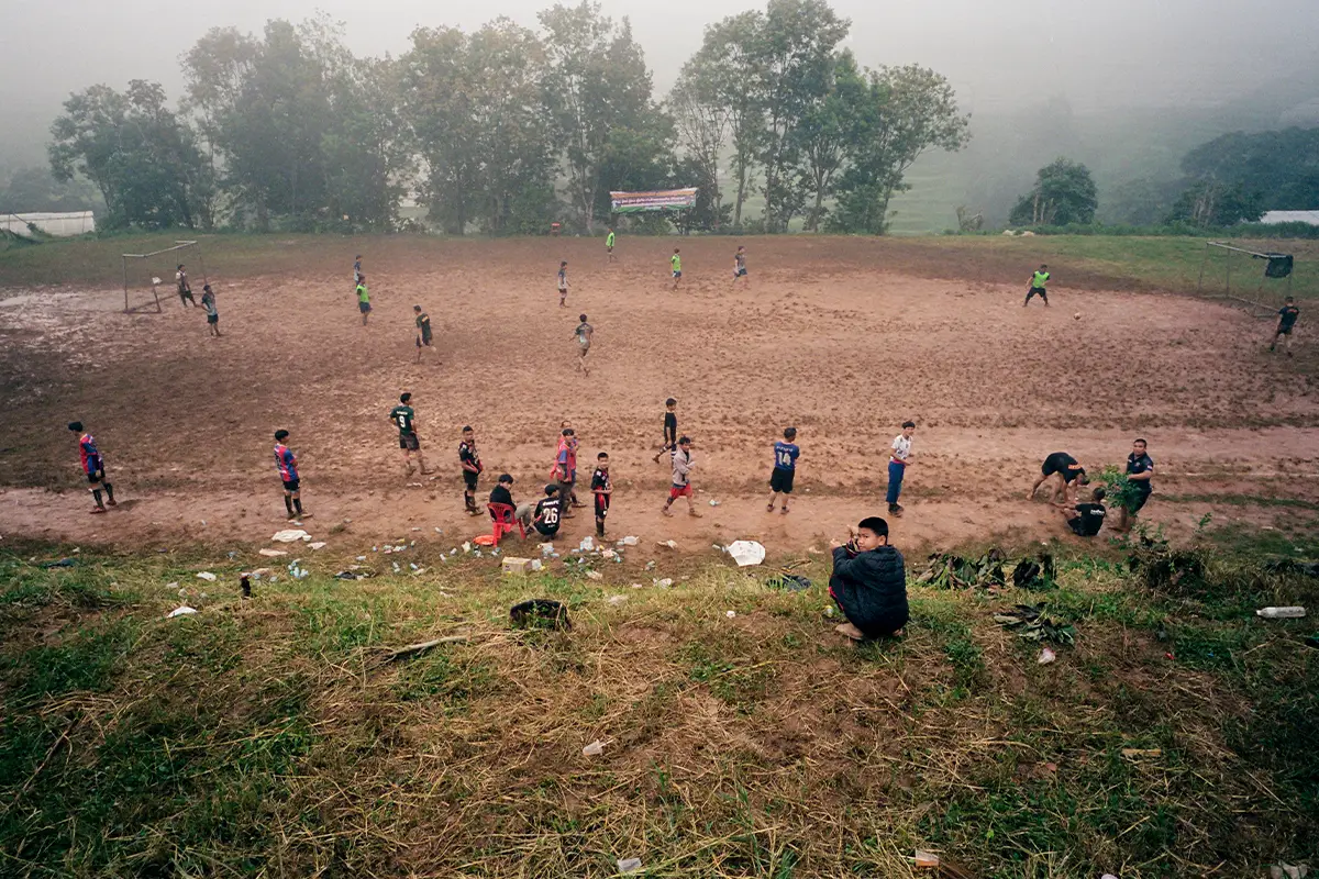 Lampoon, Kids playing football. Reportage by Giacomo Riccardi