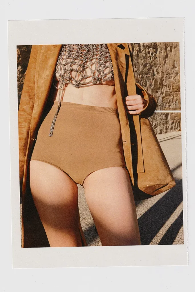 Shorts and leather coat Loewe, chain top Jeanne Friot. Photography Aliocha Wallon, styling Clotilde Franceschi