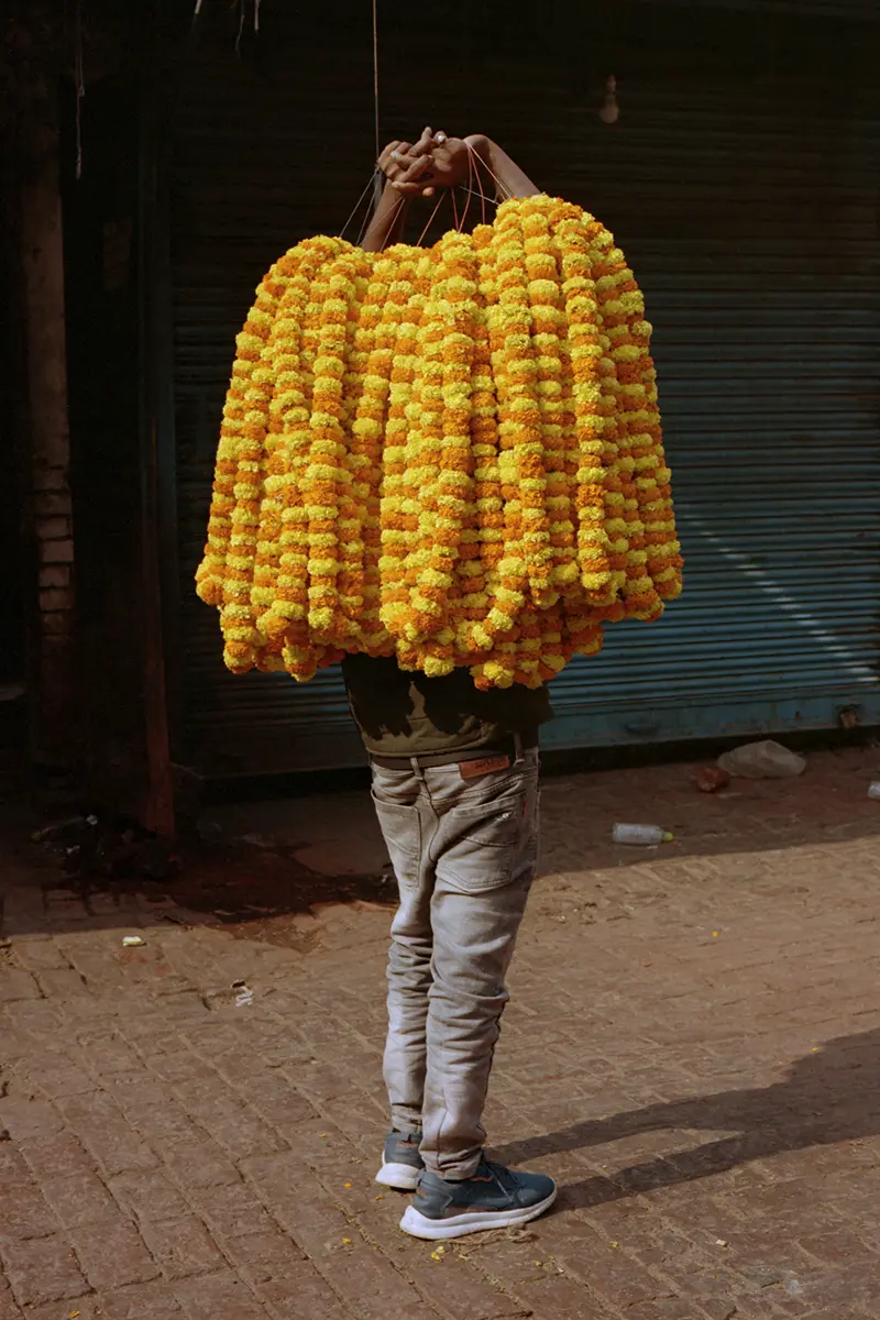 Man with marigolds. Photography Billy Barraclough
