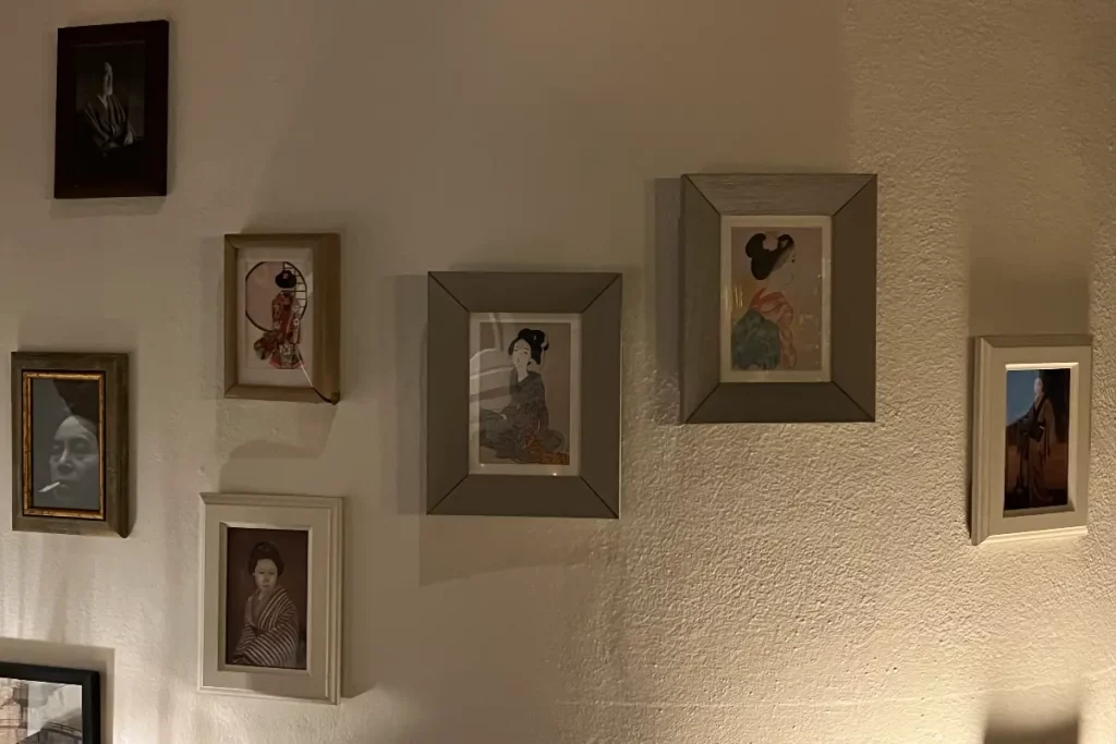 Paintings and vintage photographs on the wall, Sakeya