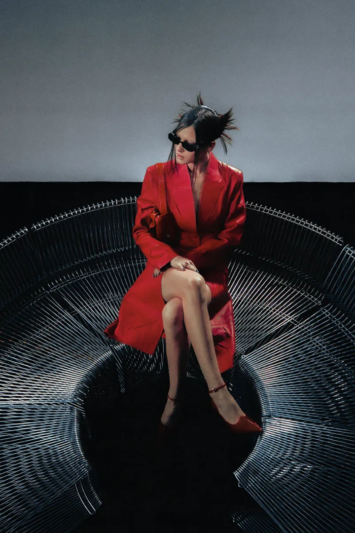 Coat, heels and bag Acne Studios, sunglasses Givenchy, ring Cartier. Photography Jeremy Soma.