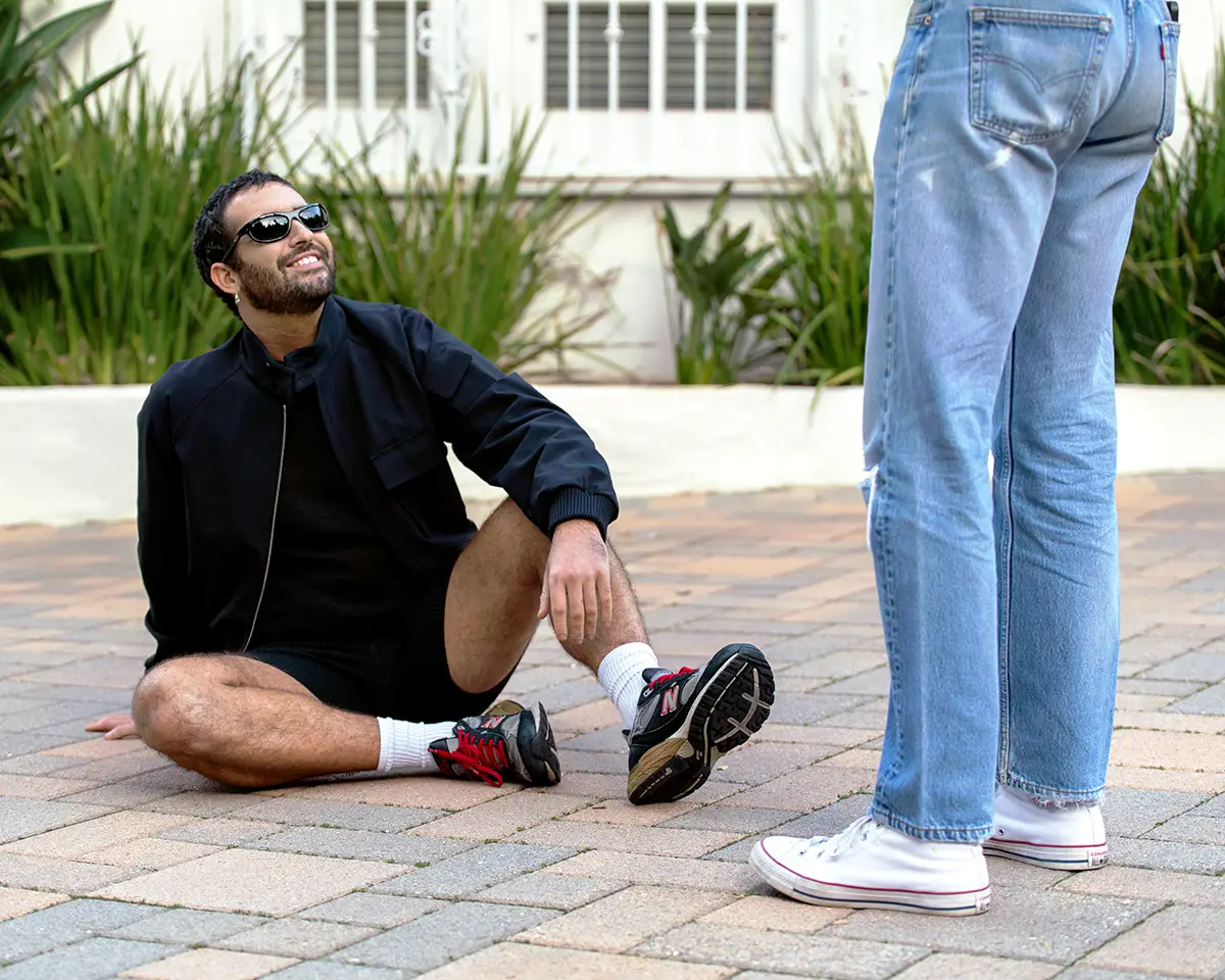 Jordan wearing bomber, top and shorts Ferragamo, sneakers stylists own