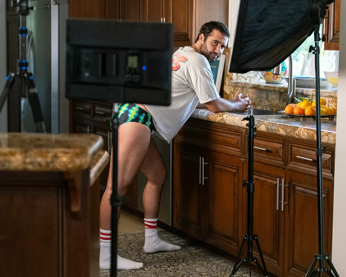Jordan wearing swimsuit and socks Palace Costume, t-shirt stylists own