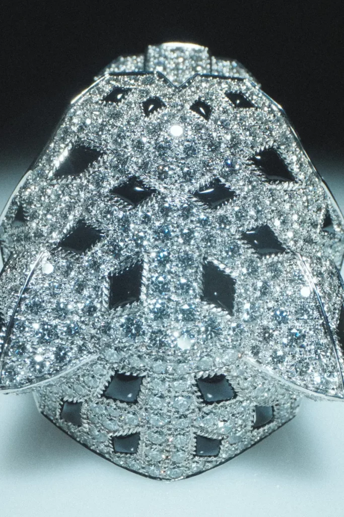 Cartier white gold Tête de Panthère ring with emerald eyes, onyx spots, onyx nose, and diamonds. Photography Anna Pogossova