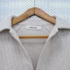 040.060 - Handwoven polo shirt in hemp, silk and linen. Available in three color variants including natural white, biochar black and licorice green. Textile Fabric Detail