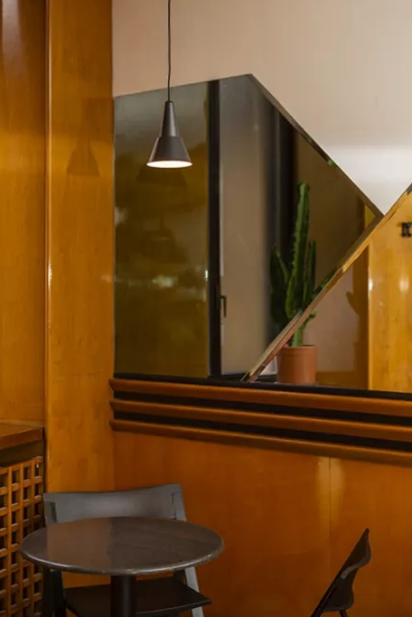 The setting is in retro style with custom designed furniture elements, Palinurobar, Milan