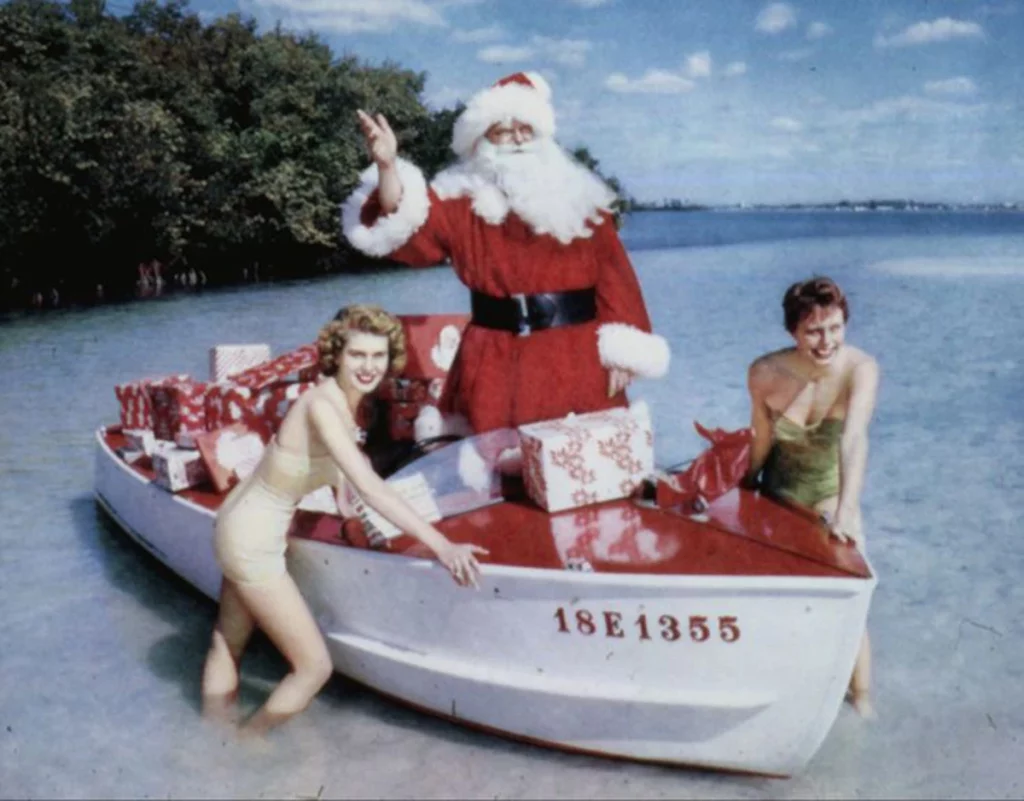 Santa Claus with presents in a boat, Sarasota, 1965 (Florida Memory State Library & Archives of Florida)