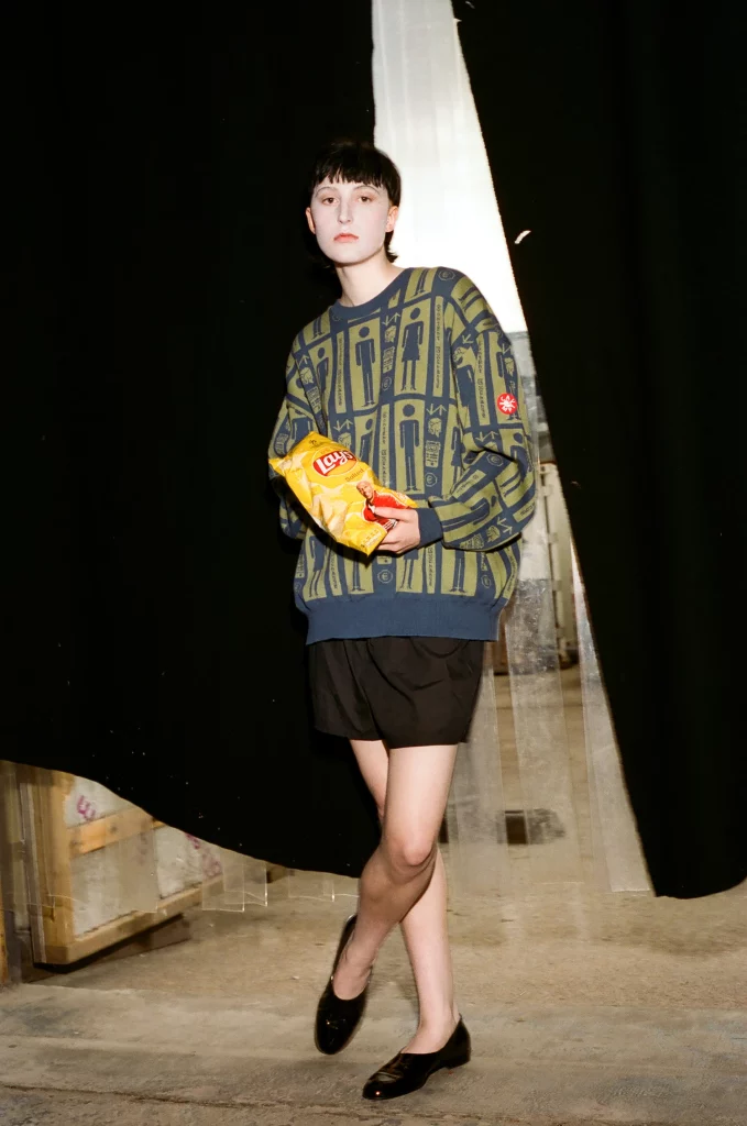 Sweater Cav Empt, shorts Sunspel, shoes Chanel.Photography Guy Bolongaro, styling Lottie Collins