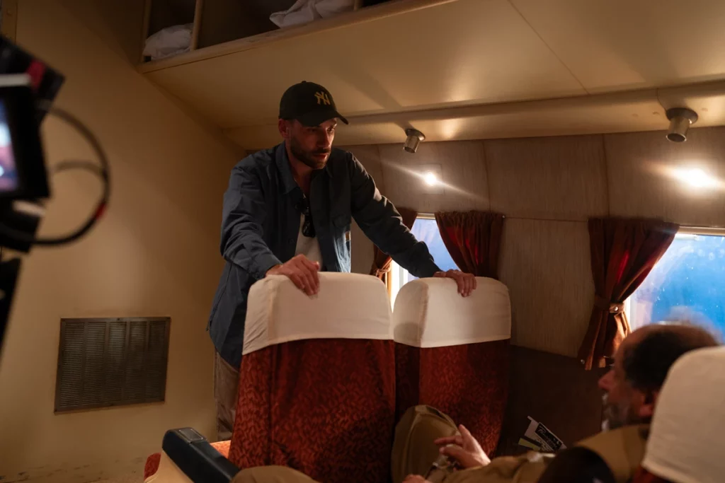 On Queer’s airplane set with Stefano Baisi and Guadagnino. Photo by Yannis Drakoulidis ©2024 The Apartment S.r.l., FremantleMedia North America, Inc., Frenesy Film Company S.r.l. All Rights Reserved