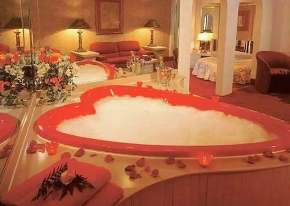 Room at Cove Haven Resort in the Poconos shows with heart-shaped bathtub by Morris Wilkins