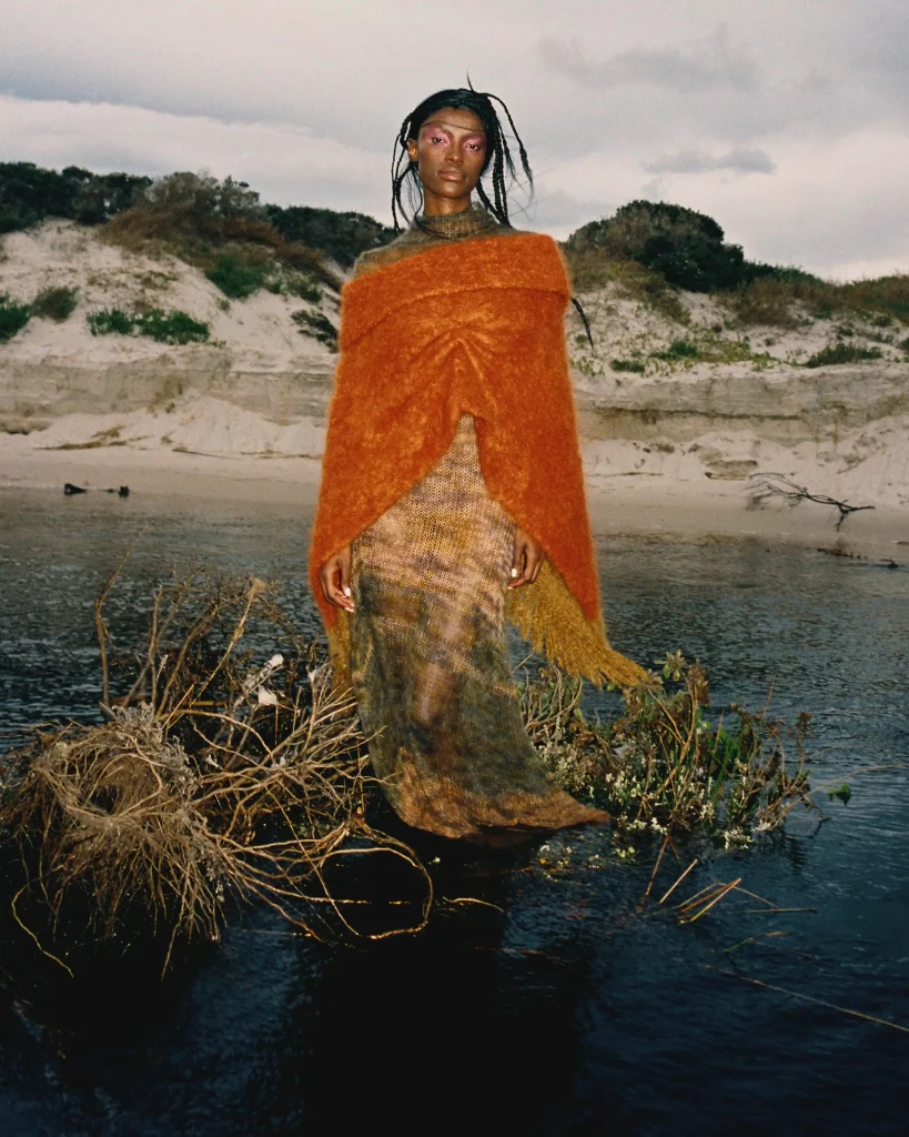 Nondi wears knit dress and pancho Lukhanyo Mdingi