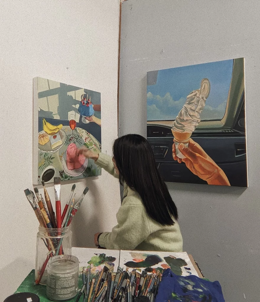 Deb Koo painting in her studio