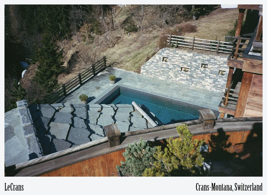 LeCrans, Crans-Montana – the outdoor pool overlooking forested slopes