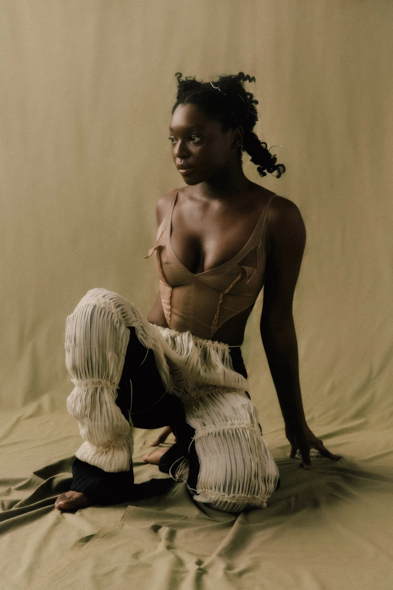 Top New Relation, pants and shoes Kriba, overpants Agapornis. Photography Leo Arnaud, styling Diamante Kayenga