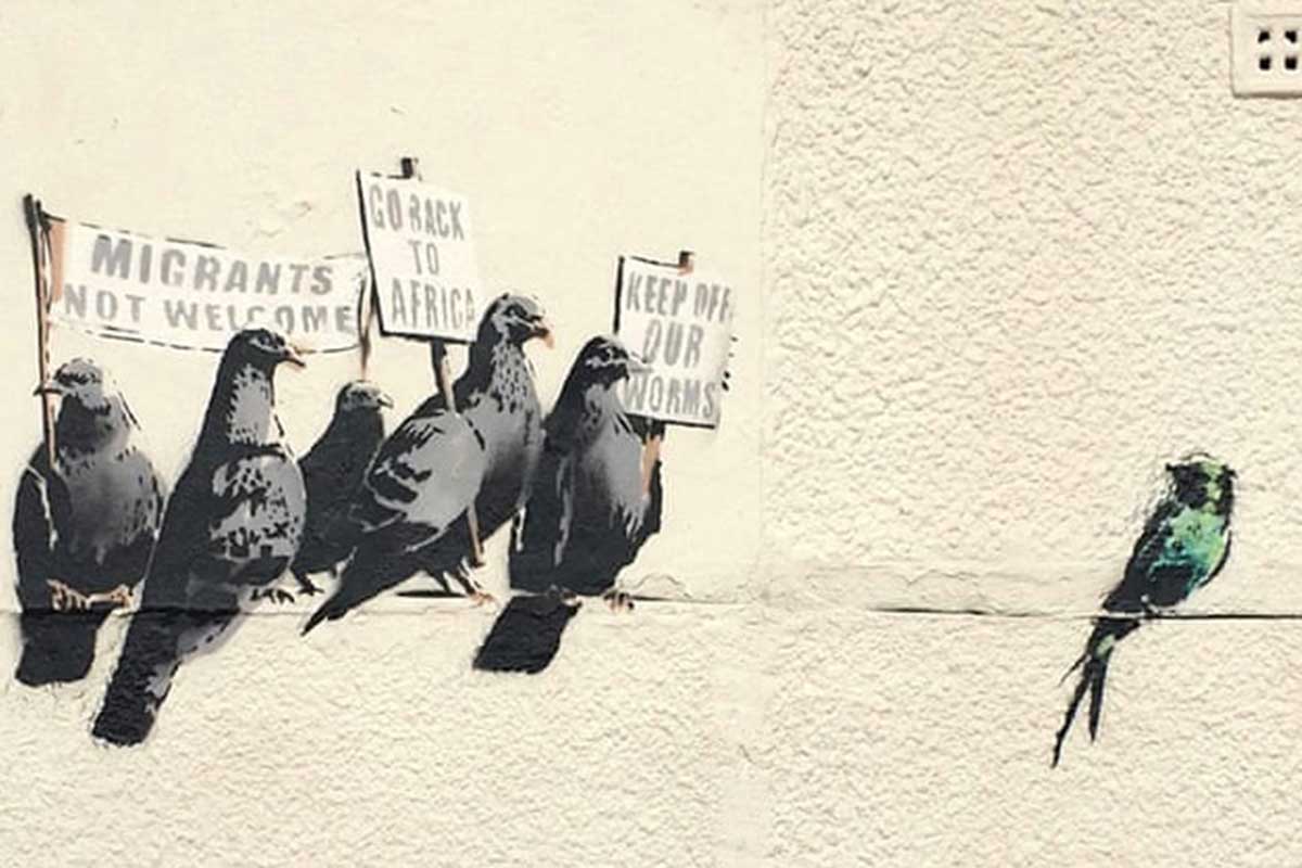 An artwork by Banksy, a satirical graffiti against immagration, about Photography Universal News and Sports