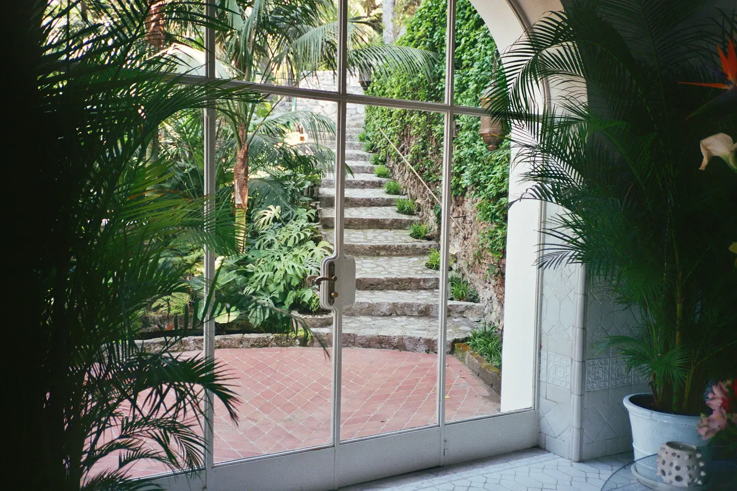 Arched shuttered window capturing morning light recalls the villa’s origins as a private residence_2 Villa Treville