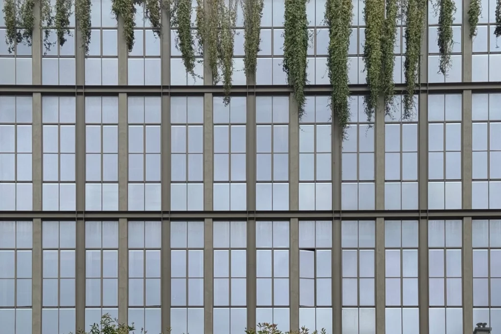 Brach Paris, south elevation – The restored concrete grid is softened by cascading planters