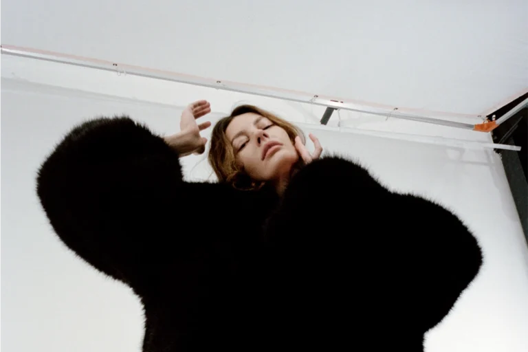 Amanda wearing coat Dion Lee