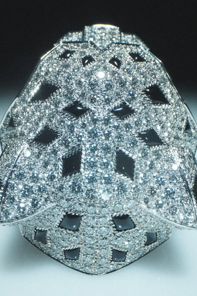 Cartier white gold Tête de Panthère ring with emerald eyes, onyx spots, onyx nose, and diamonds. Photography Anna Pogossova