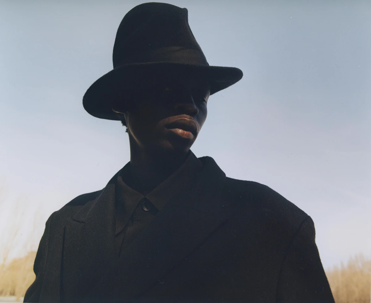 Coat Yohji Yamamoto, hat Anthony Peto. Photography Kevin Felicianne, styling Iggy Nko