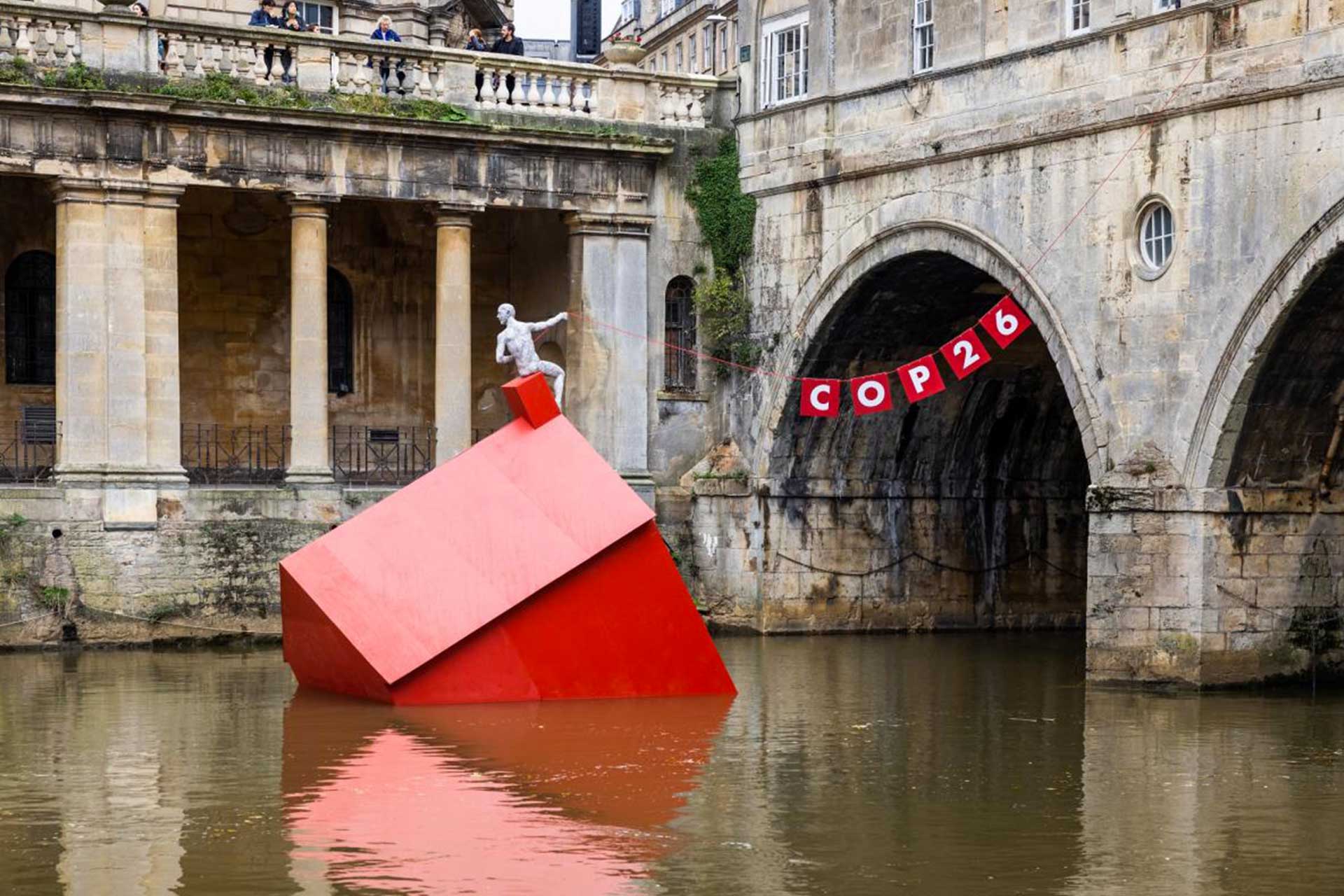 An installation of a 'Sinking House' partly submerged to highlight climate change ahead of COP26