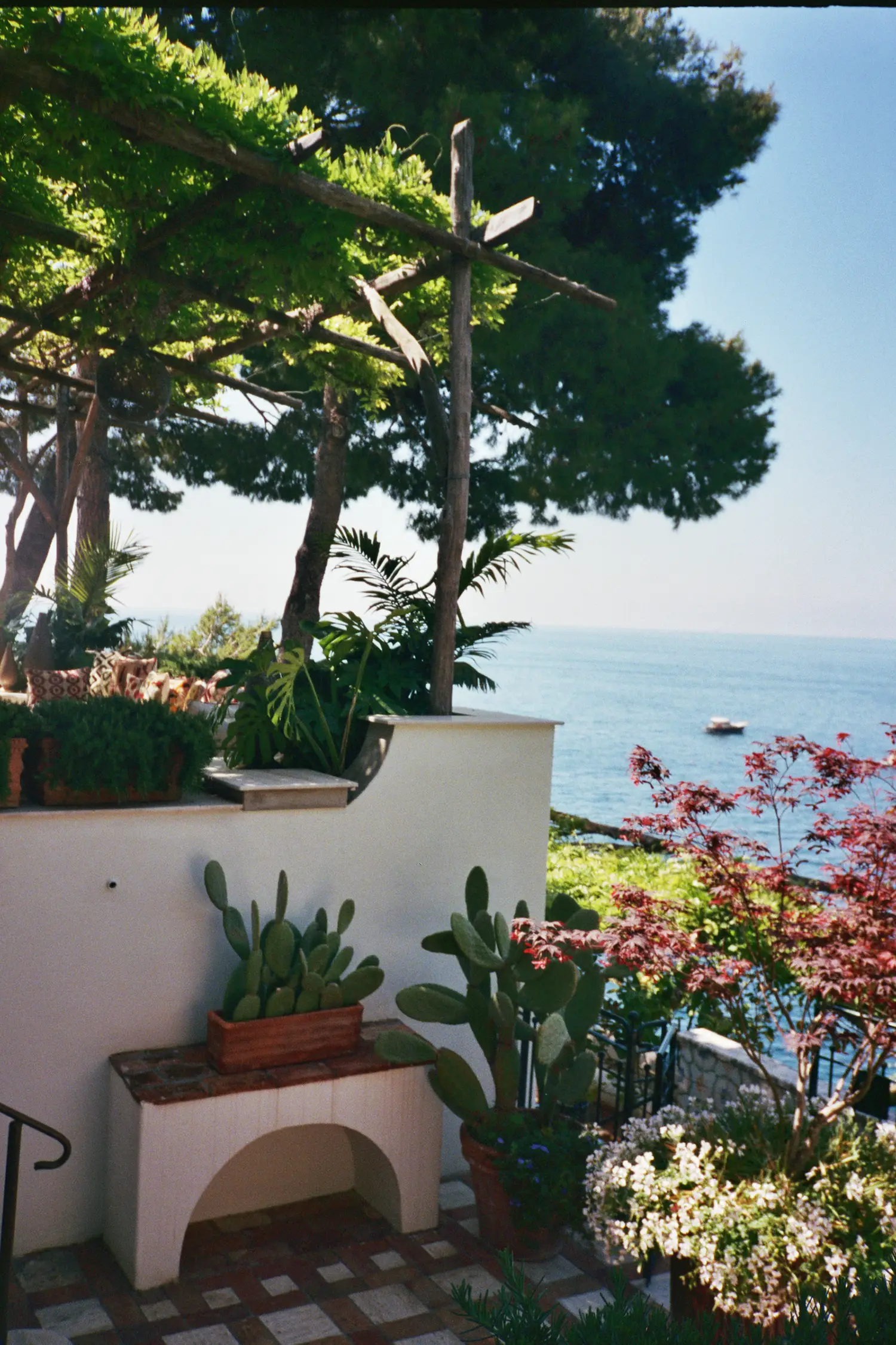 Dry-laid stone steps carved into the cliff drop to the water, a testament to local craft techniques without heavy machinery._2 VIlla Treville
