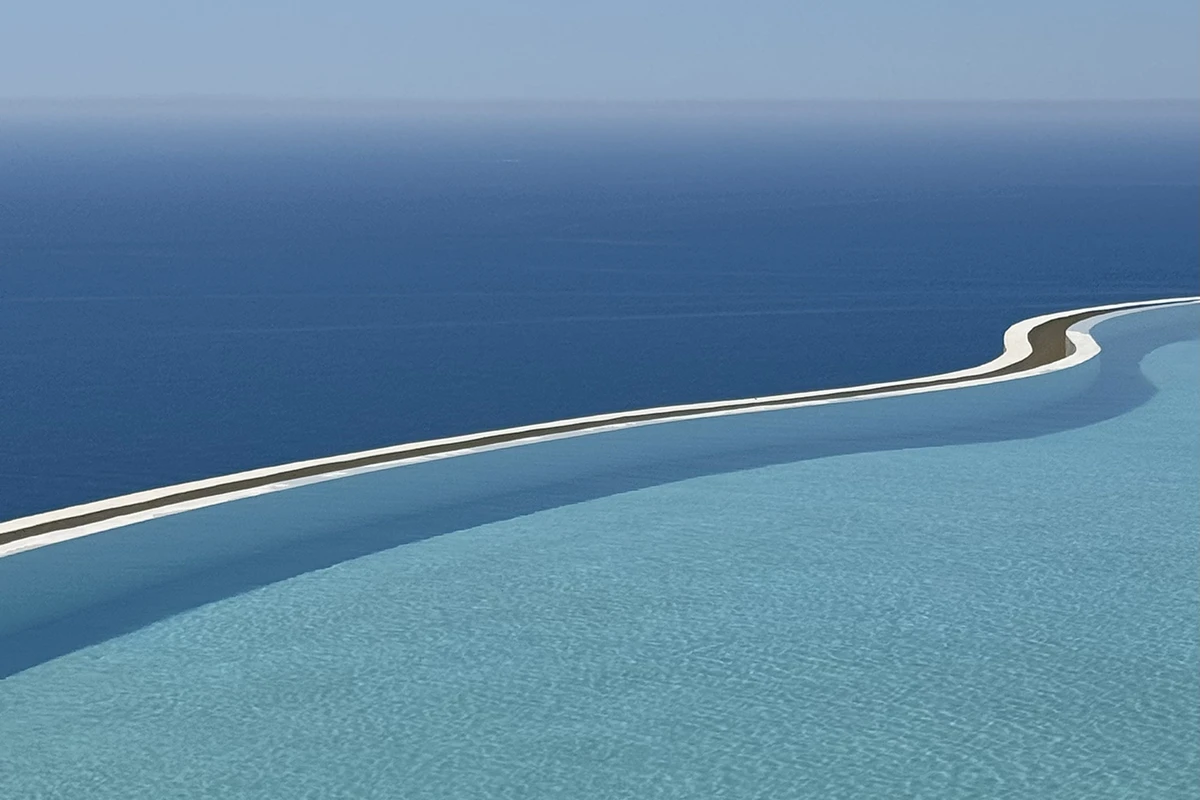 Furore Grand Hotel, curved-edge pool dissolving into the Tyrrhenian blue