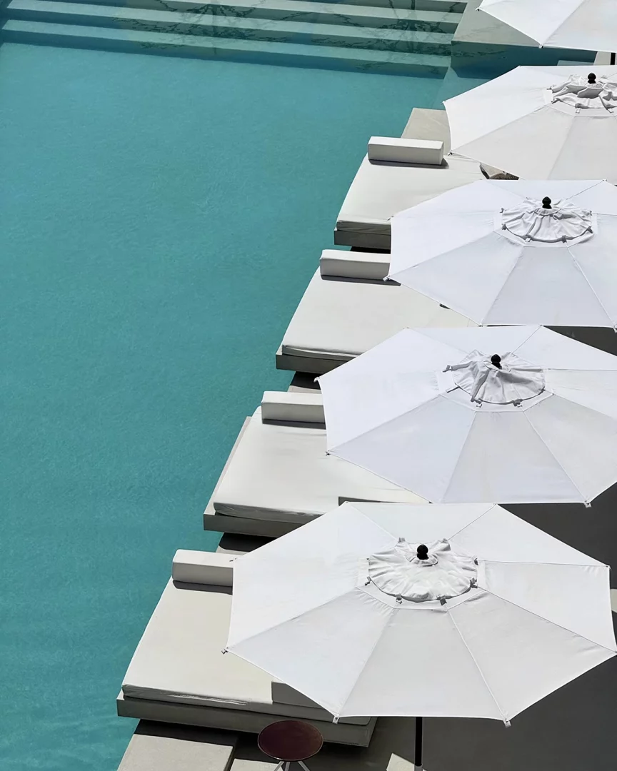 Furore Grand Hotel, infinity pool lined with crisp white umbrellas