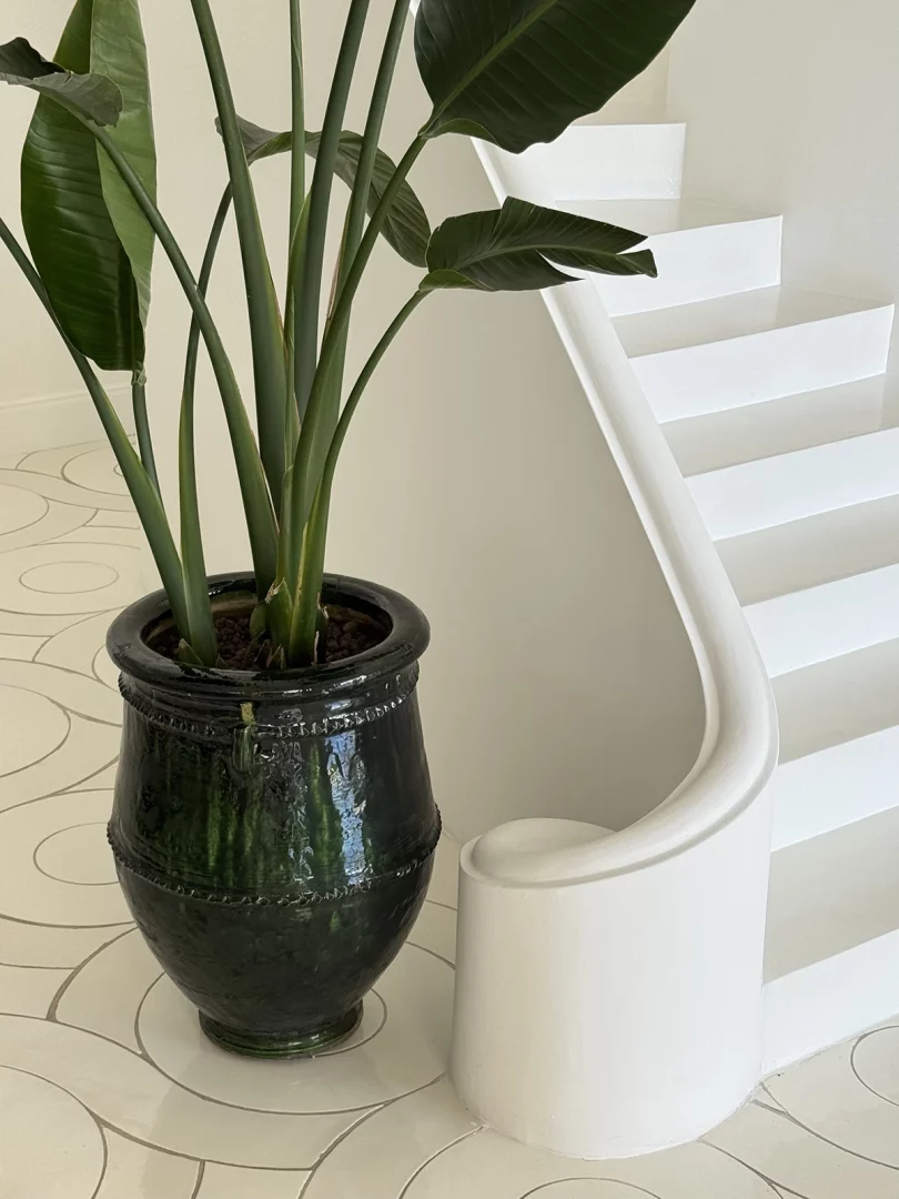 Furore Grand Hotel, sleek white stairway paired with potted foliage