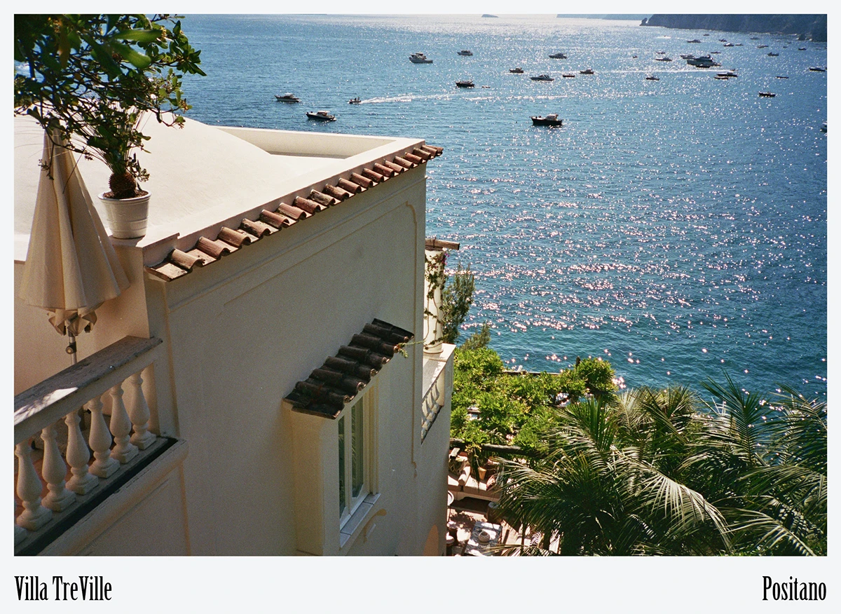 Hazy coastline panorama situates Villa Treville within the dramatic topography that dictated its tiered plan