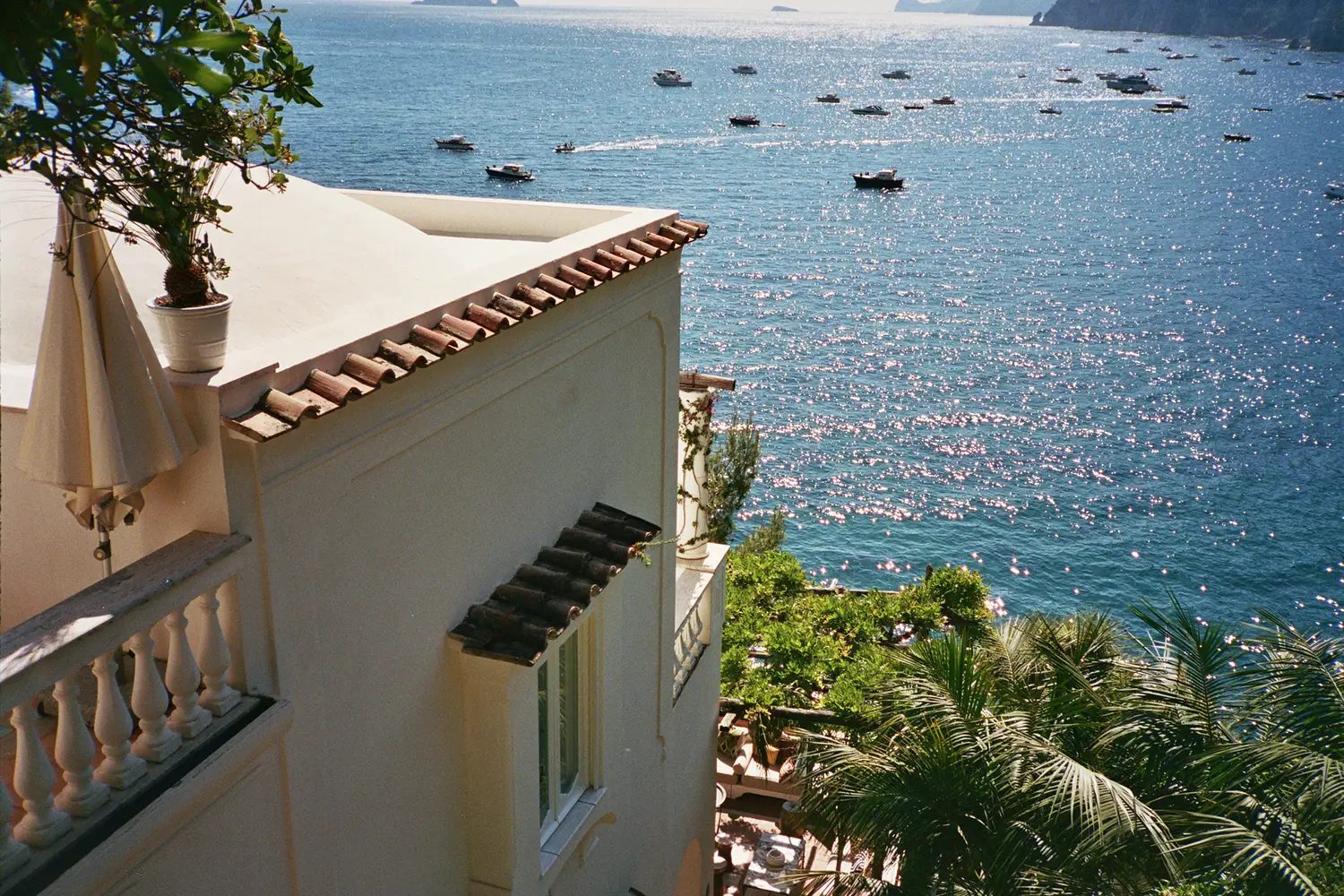 Hazy coastline panorama situates Villa Treville within the dramatic topography that dictated its tiered plan