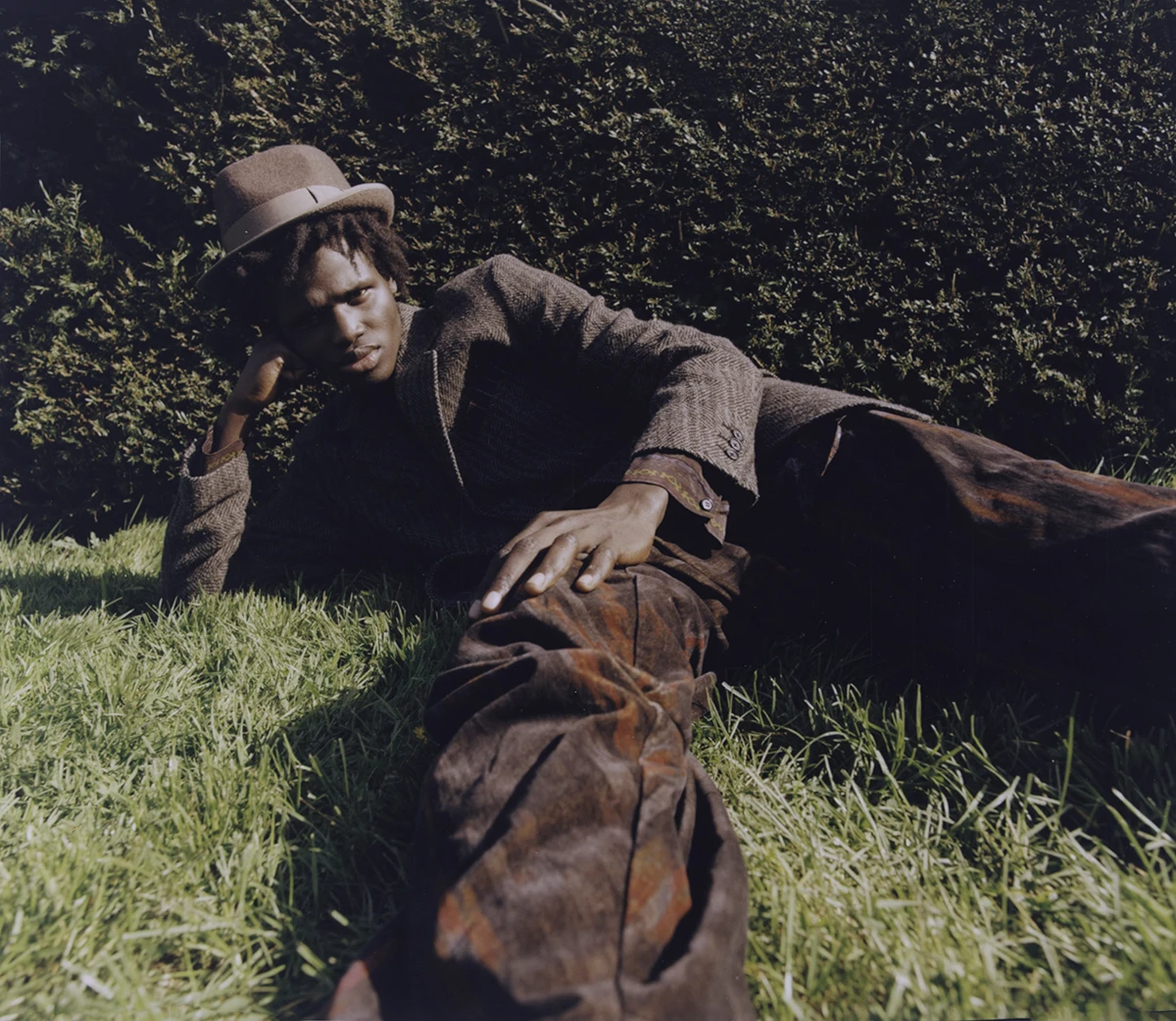 Jacket and pants Yohji Yamamoto, hat Anthony Peto. Photography Kevin Felicianne, styling Iggy Nko