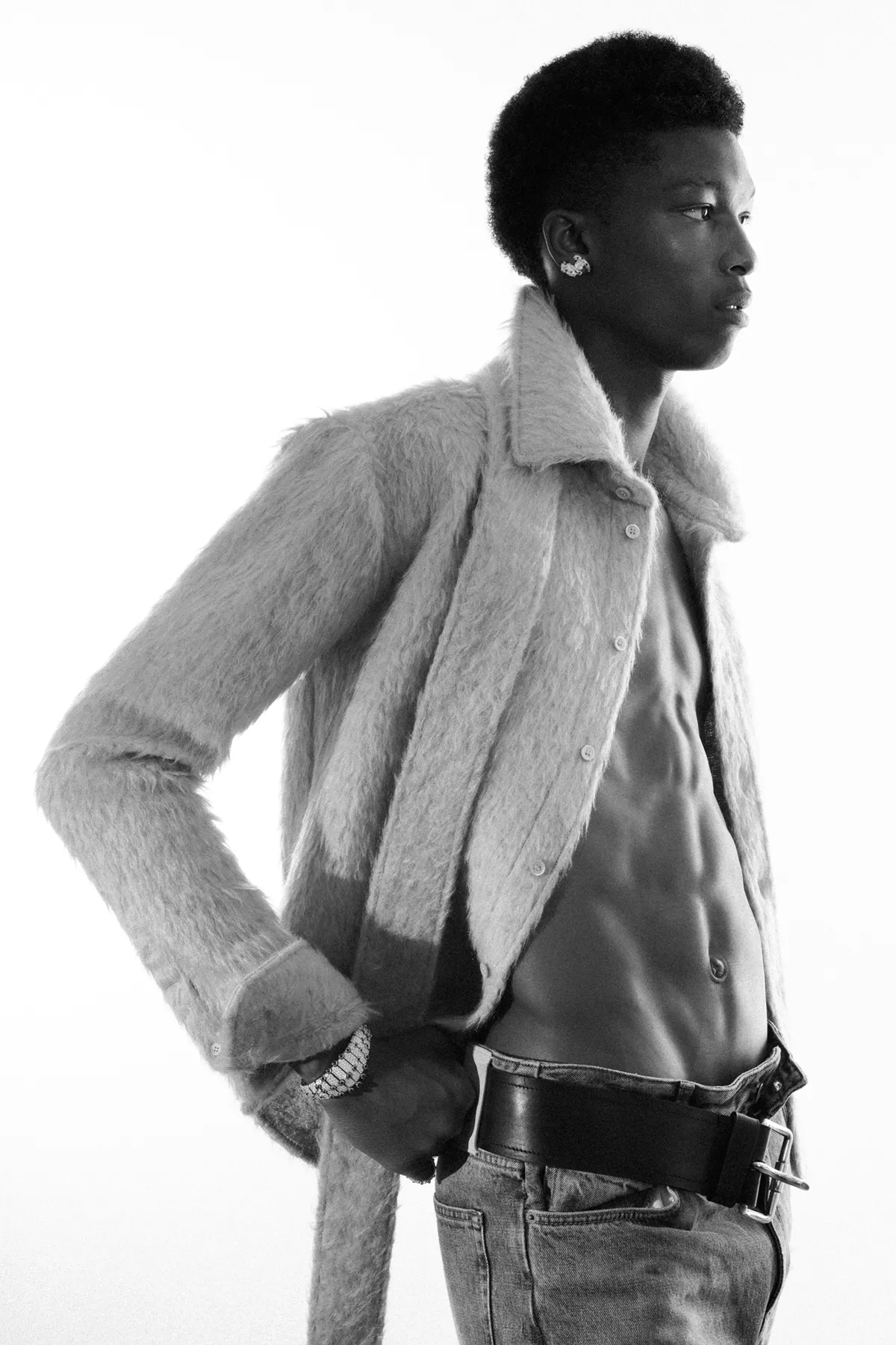 Jacket, pants and belt Loewe, jewels Cartier