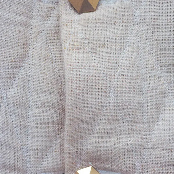 Hemp Canvas Vest, Matelassé pattern. Strong and raw. Detail of the hexagonal cufflinks buttons
