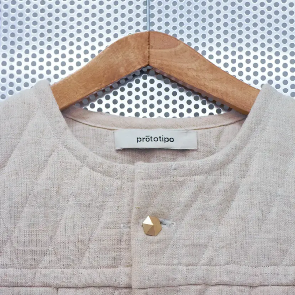 Hemp Canvas Vest, Matelassé pattern. Strong and raw with hexagonal cufflinks buttons Detail of the fabric and finishing